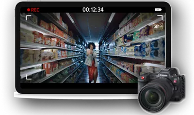monitor with a frame from Love Story movie of woman dancing in the aisle of a store